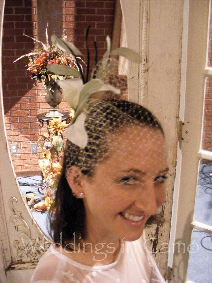 wedding comb with birdcage veiling and feathers